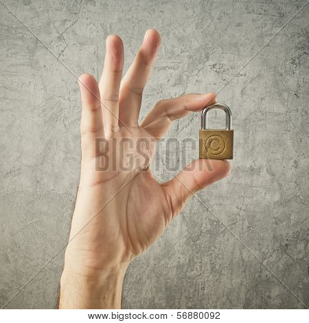 Hand Holding Padlock With Copyright Symbol
