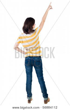 Back view of  pointing woman. beautiful brunette  girl in yellow striped t-shirt. Rear view people collection.  backside view of person.  Isolated over white background.