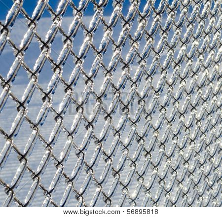 Ice coated chain link fence from an ice storm