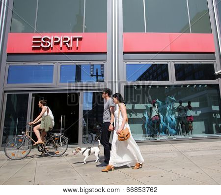 BERLIN, GERMANY - JUNE 11, 2014: Pedestrians walk past an Esprit Holdings Limited clothing store in  Berlin, Germany, on Saturday, June 11, 2014