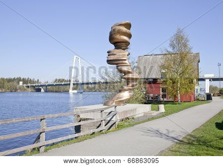 UMEA, SWEDEN ON MAY 21. Artwork, walkway and river in morning lit on May 21, 2014 in Umea, Sweden.