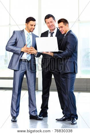 group of business people doing presetation with laptop during meeting