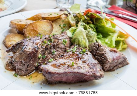 juicy steak beef meat with tomato and french fries 