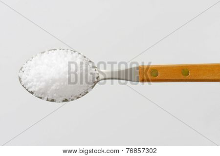 overhead view of teaspoon with pure salt