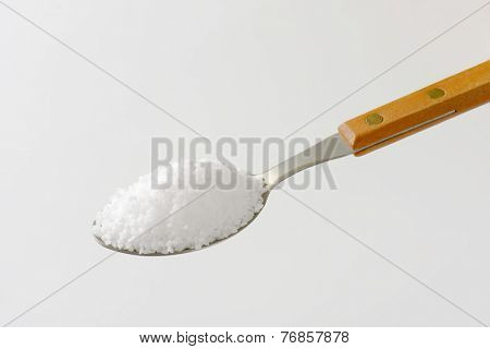 full spoon of sea salt