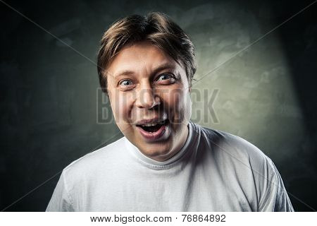 Young beautiful man surprised face expression