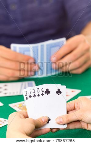 Playing cards closeup of hands holding deck