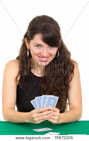 Young beautiful girl playing cards