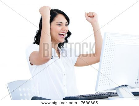 Positive  Businesswoman Punching The Air In Front Of Her Computer
