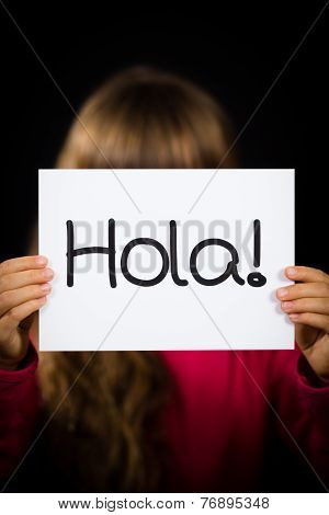 Child Holding Sign With Spanish Word Hola - Hello