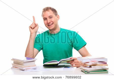 Happy Young Man Learns At His Desk
