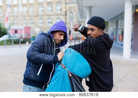 Criminal street gang of robbers taking hostage with gun