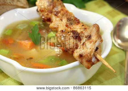 Chicken Consomme Skewers And Greens