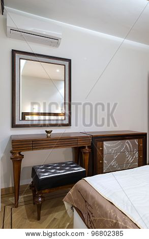 Dressing Table With Large Mirror In Bedroom Interior