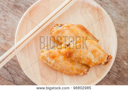 Grilled Chicken Wings On Wooden Plate
