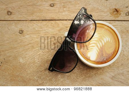 Coffee With Sun Glasses On Background Of Wooden.