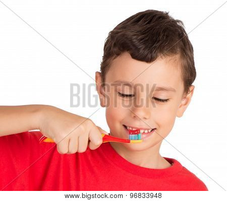 Young boy happily holding a tooth brush ready to brush his teeth