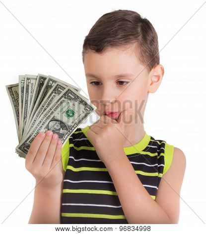 Young boy wondering what to buy with money