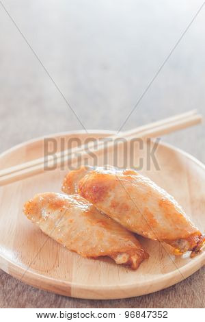 Grilled Chicken Wings On Wooden Plate