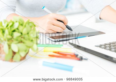 Close Up Designer Using Graphic Tablet Design On Desk