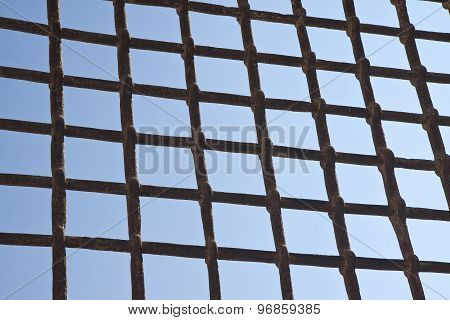 Metal Grate Against A Blue Sky - Freedom Concept