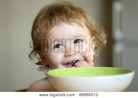 Portrait Of Little Baby Boy Eating