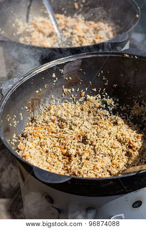 Street Food Hot Pilaw In Cauldron On Oven