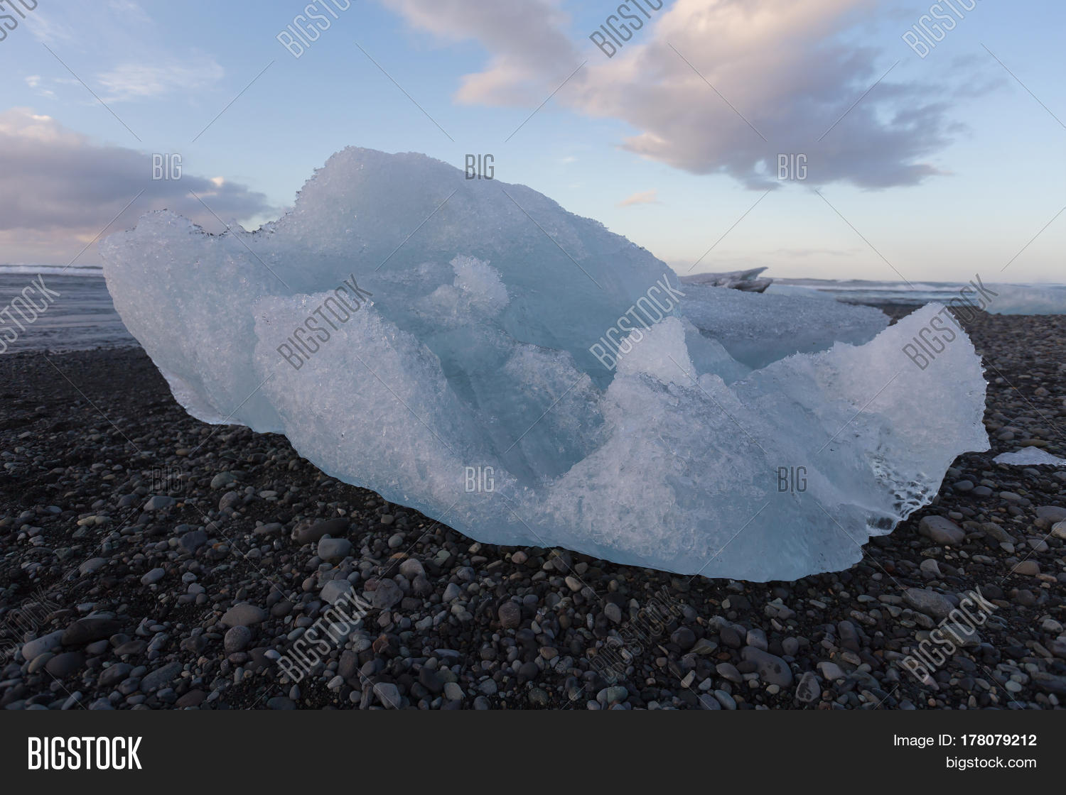Iceberg With Rocks Ice Breaking Icebergs Image & Photo (Free Trial) | Bigstock