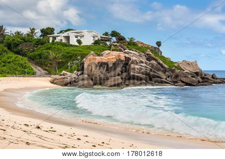Mahe Seychelles - December 15 2015: Sunny day on Anse Nord D'Est beach in the north of Mahe Island Seychelles.