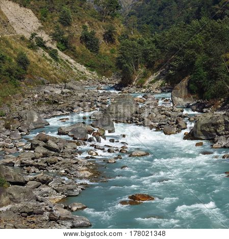 Turquoise Marsyangdi river. Scene near Jagat Annapurna Conservation Area.