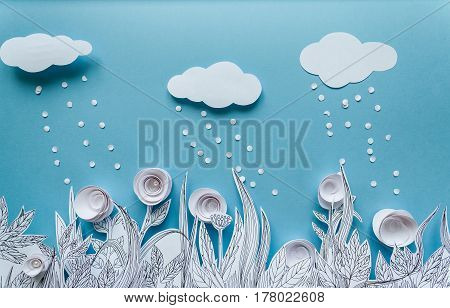 Paper art and origami concept of Flower meadow. White paper flower on blue background. Painted leaves. White cloud
