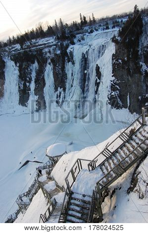 The Montmorency Falls, or Chutes Montmorency in French, is located 7 km east of Quebec City, Canada.
The falls is frozen in winter.
