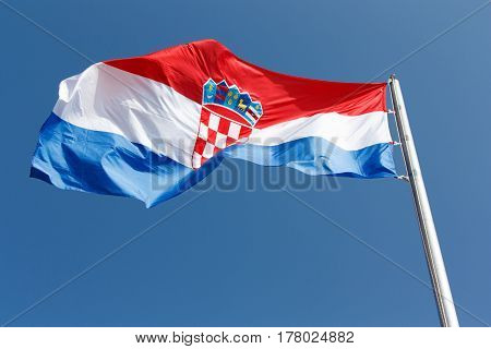 Flag national symbol of Croatia against the blue sky.