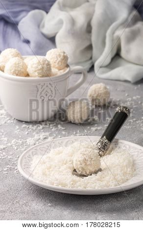 Homemade Coconut Candies In A White Plate On The Table. Sweets. Selective Focus