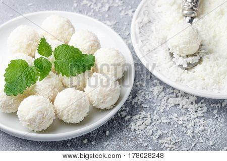 Homemade Coconut Candies In A White Plate On The Table. Sweets. Selective Focus