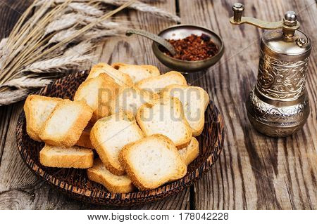 Crispy wheat crunches on wood. Studio Photo
