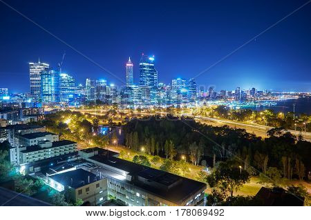Skyline city of Perth from Kings Park with a view of John Oldany Park at night. Australia .