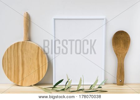 Frame mockup wood cutting board spoon olive tree branch on white background styled image product marketing banner online store