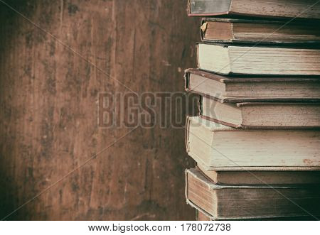 old books on wooden shelf.