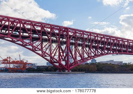Minato Bridge cross over Osaka sea port Japan red steel bridge