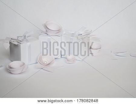 White Gifts And White Paper Flowers