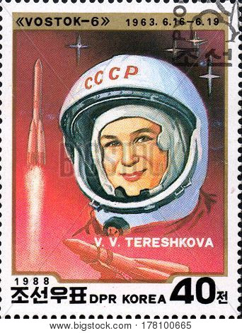 UKRAINE - CIRCA 2017: A stamp printed in DPR KOREA shows first cosmonaut woman V. V. Tereshkova circa 1988