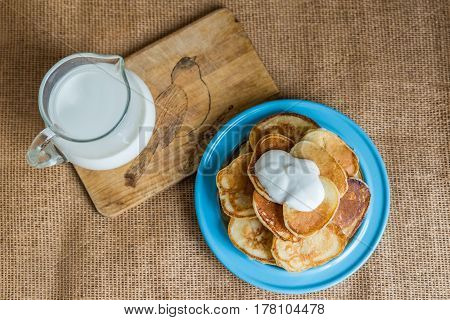 pancakes with jam, sour cream and milk