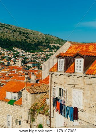 Dubrovnik Old Town, Croatia. Tiled roofs of houses. Church in the city. City View from the wall.