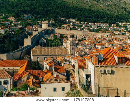 Dubrovnik Old Town, Croatia. Tiled roofs of houses. Church in the city. City View from the wall.