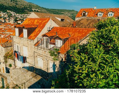 Dubrovnik Old Town, Croatia. Tiled roofs of houses. Church in the city. City View from the wall.