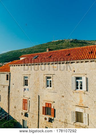 Dubrovnik Old Town, Croatia. Tiled roofs of houses. Church in the city. City View from the wall.