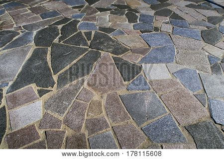 ASSENS DENMARK - MARCH 24 2017: Closeup tiling at the end of the modern designed walkway on pier a springtime day close to the sea. March 24 2017 Assens Funen Denmark.