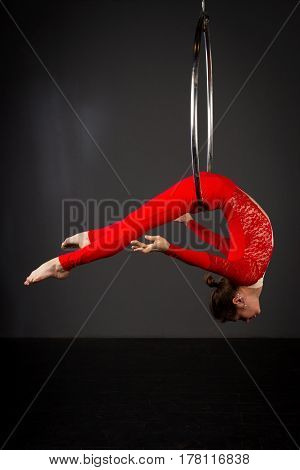 Woman Exercising On Lyra