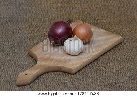three species of onions on the cutting board